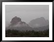 Misty Rain Clouds Swirling Around Red Rocks In Sedona by Charles Kogod Limited Edition Print