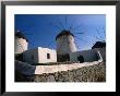 Thatched-Roof Windmills On Plateau, Mykonos Town, Greece by Wayne Walton Limited Edition Print