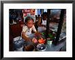 Woman Cooking In Street Stall, Mersing, Malaysia by Chris Mellor Limited Edition Print