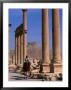 Rider On Camel Walking Along The Colonnaded Street Of Ruins, Palmyra, Syria by John Elk Iii Limited Edition Print