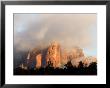 Sunlight Burning Off Morning Fog Surrounding The Red Rocks Of Sedona by Charles Kogod Limited Edition Print