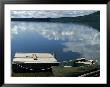 Rowboat Moored At Edge Of Lake Showing Reflections Of Clouds In Its Still Waters, In New England by Dmitri Kessel Limited Edition Print
