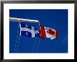 Canadian And Quebec Flags At Full Mast, Montreal, Canada by Wayne Walton Limited Edition Pricing Art Print