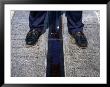 Feet Standing On The East/West Meridian Line At The Royal Observatory, Greenwich, London, Uk by Charlotte Hindle Limited Edition Print