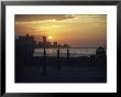 A Couple Embraces On Havanas Malecon by David Evans Limited Edition Print