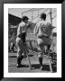 Yankee Greats Joe Dimaggio And Lou Gehrig Behind Backstop Watching Batting Practice by Carl Mydans Limited Edition Print