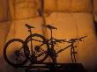 Silhouette Of Mountain Bikes On A Car Roof Rack At Sunset by Images Monsoon Limited Edition Print