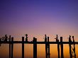People Crossing The Ubein Bridge In Mandalay, Myanmar At Sunset by Scott Stulberg Limited Edition Print