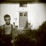 Portrait Of A Teenage Boy Standing In Front Of An Abandoned House, Boden, Norrbotten, Sweden by Inger Bladh Limited Edition Print