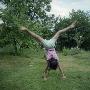 Rear View Of A Girl Doing A Cartwheel In A Park by Mikael Andersson Limited Edition Print