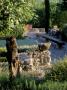 La Chabaude, France, Designer: Scott Stover: Stone Wall, Gravel Terrace, Long Wooden Bench by Clive Nichols Limited Edition Print