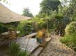 Exotic Shade Planting - Phormium, Bamboo, Rosemary And Other Foliage Over Dining Area, Kathy Taylor by Clive Nichols Limited Edition Print