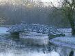 Ornamental Bridge Across A Lake In The Neo-Classical Park Garden, Designer: Quinlan Terry by Clive Nichols Limited Edition Print