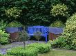 Blue Bench With Lead And Rusty Metal Containers Planted With Holly And Box, Designer: Tony Ridler by Clive Nichols Limited Edition Pricing Art Print