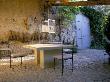 La Chabaude, France - Cobbled Terrace With Table And Chairs, Designer: Scott Stover by Clive Nichols Limited Edition Print