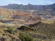 View Of Large Copper Pit Mine, With Colorful Workings In The Desert by Stephen Sharnoff Limited Edition Print