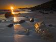 Early Morning Sunshine On Sandstone Boulders, Dunstanburgh Beach, Northumberland, England by Adam Burton Limited Edition Pricing Art Print