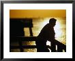 Silhouette Of Man On Pier, Fl by Jeff Greenberg Limited Edition Print