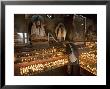 Old Woman Lighting Butter Lamps In Front Of Buddha Statues Draped With New Silk Scarves by Don Smith Limited Edition Pricing Art Print