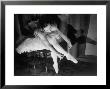 Premier Ballerina Semionova Tying Her Toe Shoe Before A Performance At The Great Theater by Margaret Bourke-White Limited Edition Print