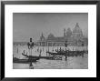 Moored Gondolas In Grand Canal By Flooded Piazza San Marco With Santa Maria Della Salute Church by Dmitri Kessel Limited Edition Print