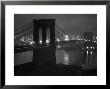Glittering Night View Of The Brooklyn Bridge Spanning The Glassy Waters Of The East River by Andreas Feininger Limited Edition Print