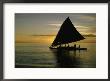 Silhouetted Outrigger Canoe On The Koro Sea by Thomas J. Abercrombie Limited Edition Print