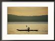 A Woman Paddles Her Kayak On The Calm Water At Twilight by Skip Brown Limited Edition Pricing Art Print
