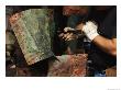 Restorer Removing Copper Cover From The Hull Of The U.S.S. Constitution During Its Restoration by Maria Stenzel Limited Edition Print