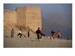 Children Playing Soccer Near Disused Fort, Kabul, Afghanistan by Stephane Victor Limited Edition Print