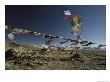 Prayer Flags Blow In The Wind Atop A High Pass On A Tibetan Plateau by Gordon Wiltsie Limited Edition Print