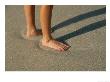 Feet In The Wet Sand Of A Beach Wait For The Next Surge Of Surf by Paul Damien Limited Edition Print