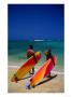 Couple With Colourful Surfboards On Beach Near Waikiki, Waikiki, U.S.A. by Ann Cecil Limited Edition Print