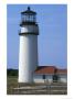A Lighthouse Against A Blue Sky With A Wooden Fence Nearby by Darlyne A. Murawski Limited Edition Print