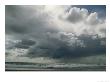 Dramatic Storm Clouds Over Ocean Water by Charles Kogod Limited Edition Print