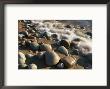 Water Washes Up On Smooth Stones Lining A Beach by Michael S. Lewis Limited Edition Print