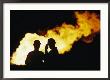 Natural Gas Workers Silhouetted By Burning Dross by George F. Mobley Limited Edition Print