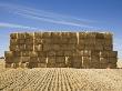 Stacked Bales Of Hay In A Field by Tobias Titz Limited Edition Print