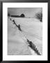 Four Ft. Of Snow Almost Covering Up Snow Fence In Front Of Barn On The Hill On Upstate Farm by Andreas Feininger Limited Edition Pricing Art Print