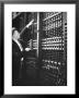 Technician Manipulating 1 Of Hundreds Of Dials On Panel Of Ibm's Room Size Eniac Computer by Francis Miller Limited Edition Print
