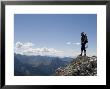 Rock Climber Stands On A Mountain Summit In The Dolomites, Italy by Bill Hatcher Limited Edition Print