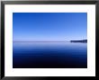 Clear Blue Sky Reflected In A Still Lake Surface, Metung, Gippsland Lakes, Victoria, Australia by Jason Edwards Limited Edition Print