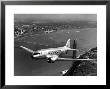 Canadian Colonial Airways Passenger Plane Flys Over George Washington Bridge In Montreal, Canada by Margaret Bourke-White Limited Edition Print