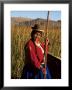 Uros Indian Woman In Traditional Reed Boat, Islas Flotantes, Lake Titicaca, Peru, South America by Gavin Hellier Limited Edition Print