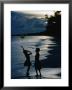 Young Girls Playing With A Balloon On Kiriwina Island, Kiriwina Island, Milne Bay, Papua New Guinea by Michael Gebicki Limited Edition Pricing Art Print