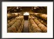 Oak Barrels In Wine Cellar At Groth Winery In Napa Valley, California, Usa by Julie Eggers Limited Edition Print