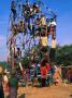 Man Operated Ferris Wheel At Pindaya Festival, Pindaya, Shan State, Myanmar (Burma) by Bernard Napthine Limited Edition Print