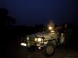 Night Game Drive, Kulefu Camp, Zambia by Roger De La Harpe Limited Edition Print