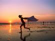 Silhouette Of Girl Running On Beach At Sunset, Ma by Kindra Clineff Limited Edition Print