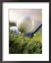 Golf Ball On Wooden Tee With Driver In Background by Eric Kamp Limited Edition Print
